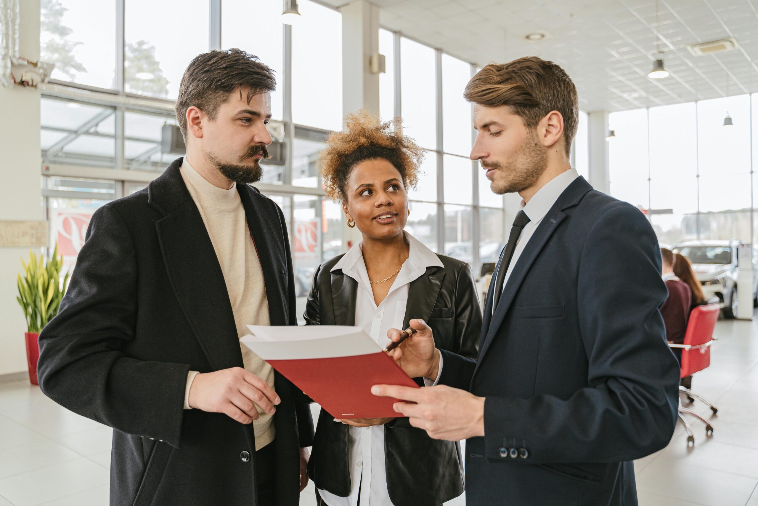 Sales representative speaking directly with customers during an in-person marketing interaction
